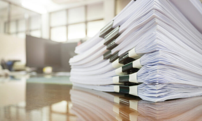stack of files on a desk